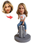 Custom Bobblehead Sitting On a Suitcase