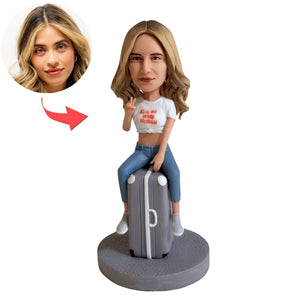 Custom Bobblehead Sitting On a Suitcase
