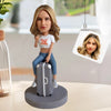 Custom Bobblehead Sitting On a Suitcase